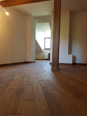 Oak floors running at a 45 degree angle and finished with a hardwax oil wood finish.