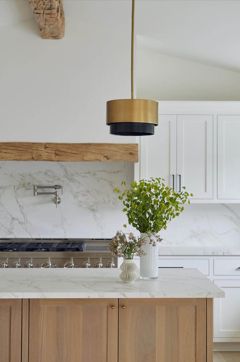 Natural white oak kitchen island with faux marble counter top.