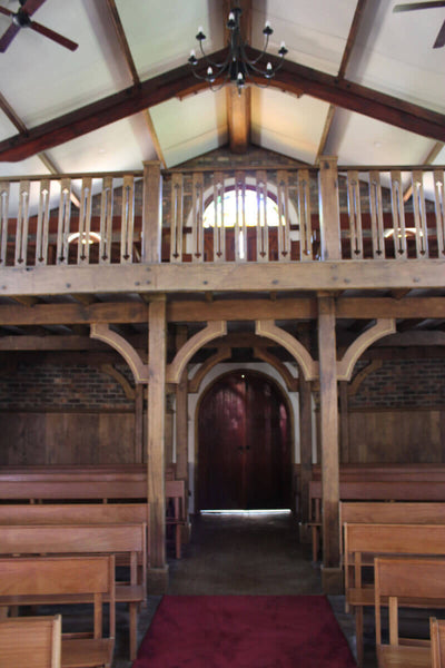 Renovating wood pews and balcony in a church.