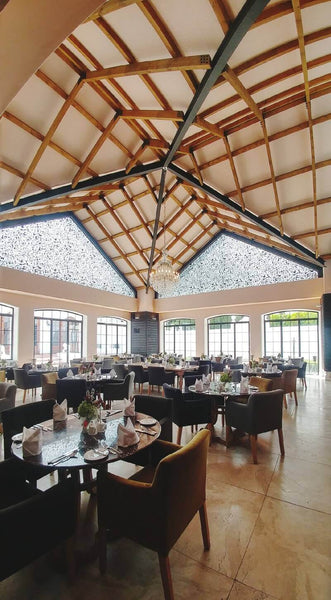 Exposed ceiling beams finished with natural wood finish.