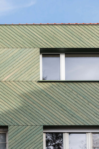 Close up of chevron patterned wood siding.