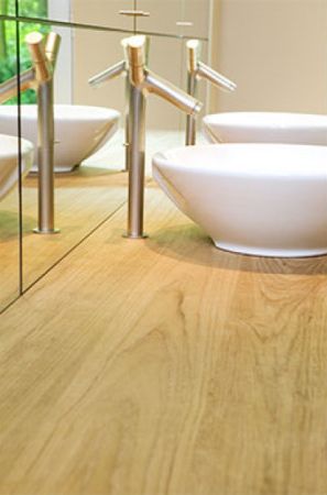 Close up of wooden bathroom counter top finished with Rubio Monocoat.