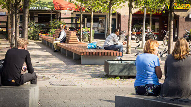 A wood bench in a park.