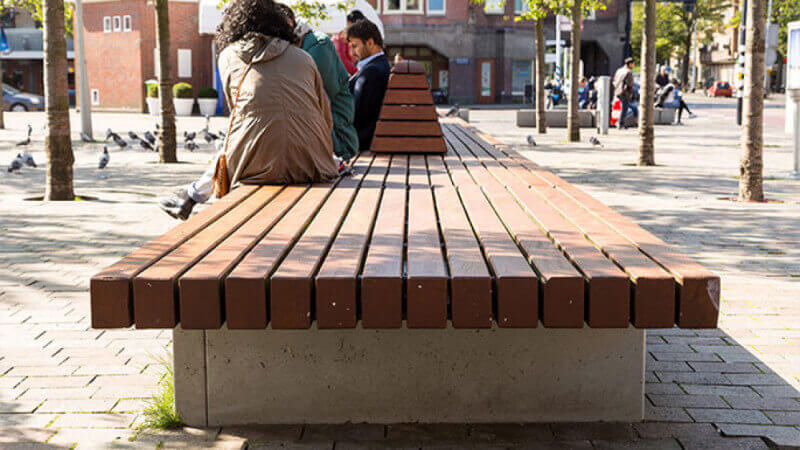 A wooden park bench finished with a hardwax oil wood finish.