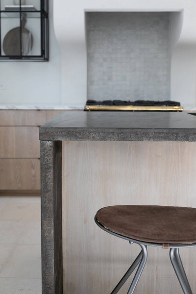 Kitchen island with oak wood front on it.