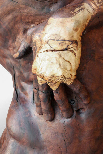 Beautiful detail of hand on wooden sculpture finished with Rubio Monocoat.