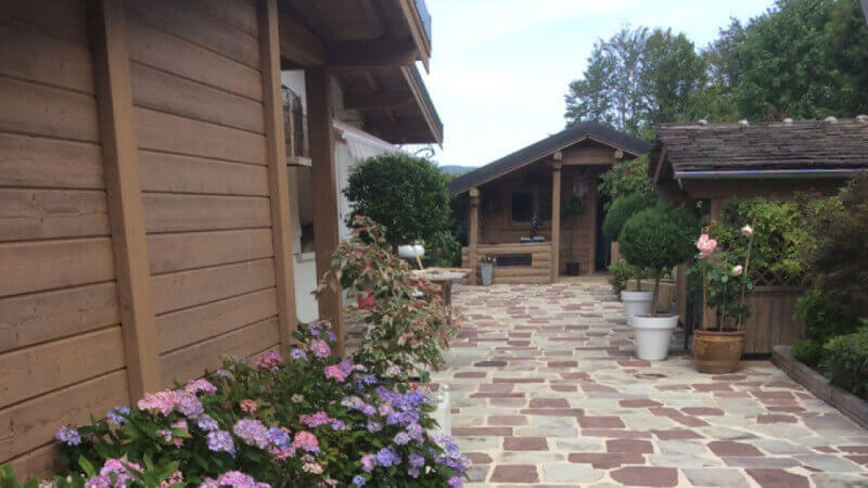 Wooden chalet siding that was renovated using Rubio Monocoat wood finishing products.