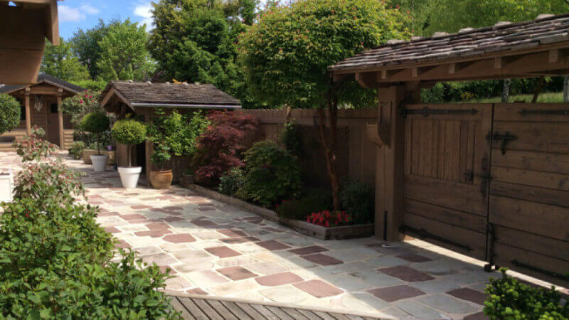 A fence and gate that were renovated and restored using Rubio Monocoat hardwax oil wood finish.