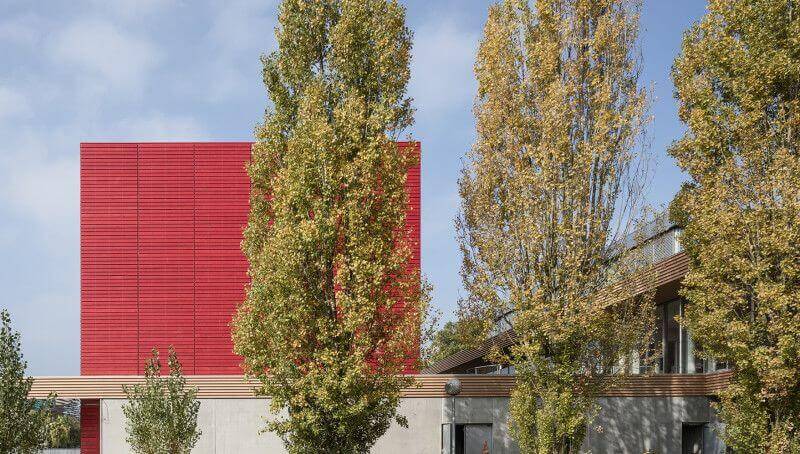 Vibrant color from Rubio Monocoat used to finished exterior wood on library.