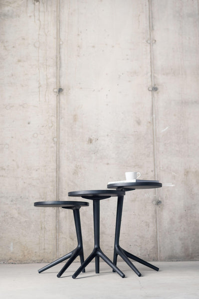A stack of custom wood side tables.