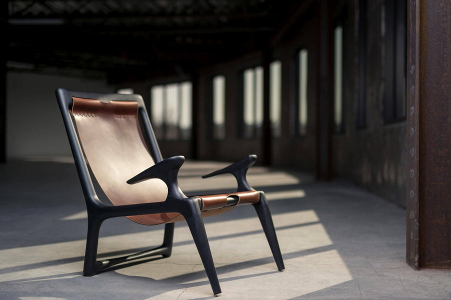 Customer wooden carved chair with leather back.