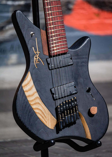 Matte black 7 string electric guitar body.