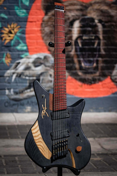 Matte black 7 string electric guitar.