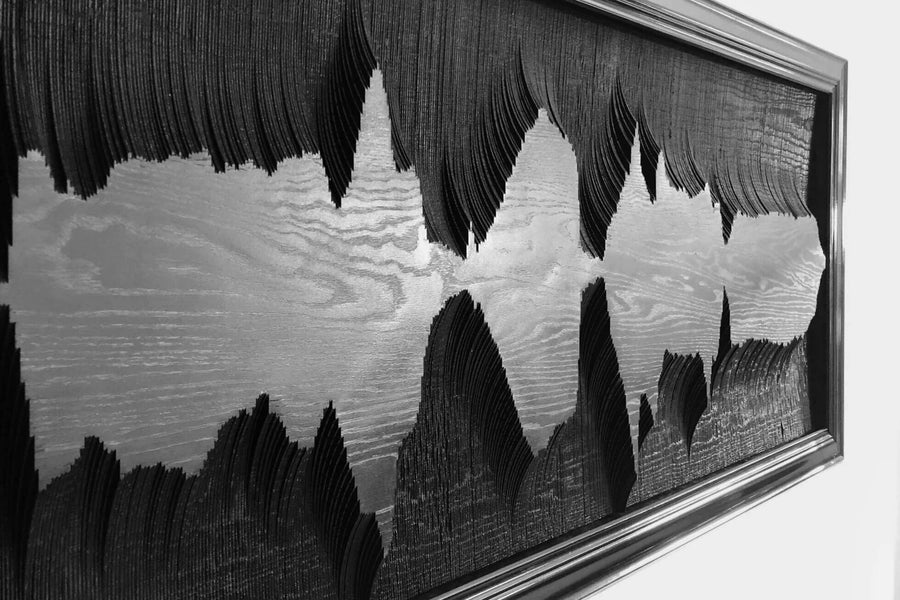 Black colored sound wave wood art.