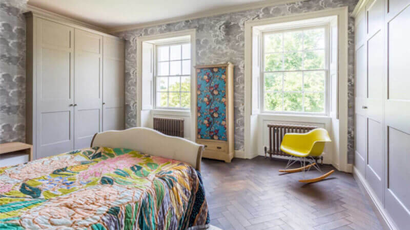 A durable hardwood floor finish in a bedroom.