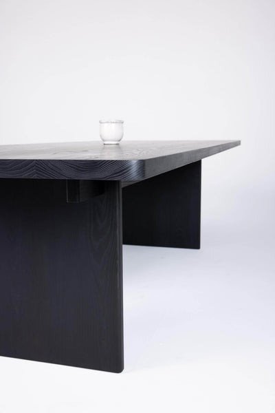 Custom midcentury modern dining table made from ash wood, stained black and finished with a natural oil wood finish