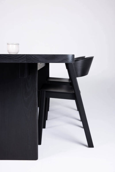 Ash wood midcentury modern dining table and chair with black stain and natural oil finish
