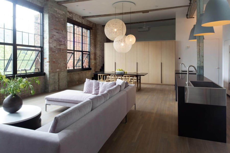 New York loft with hardwood flooring and brick walls.